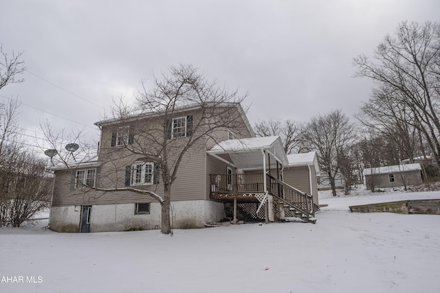 view of snow covered house