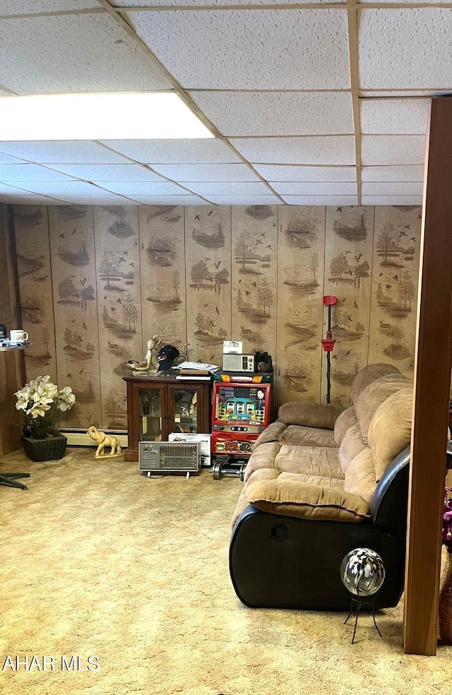 living area featuring a paneled ceiling