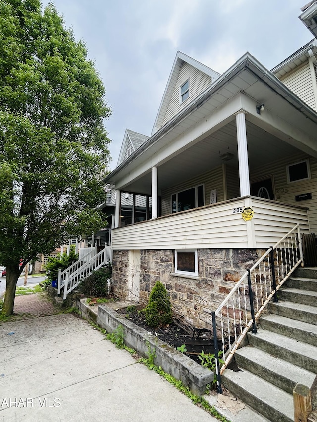 205 1st Ave, Altoona, PA 16602 - view of property exterior with a porch and stairway