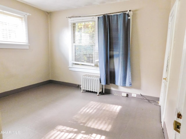 empty room featuring radiator heating unit