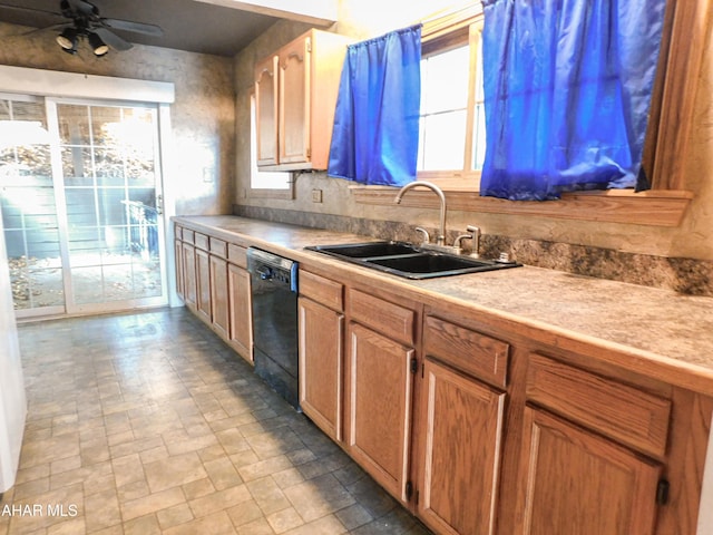 kitchen with ceiling fan, black dishwasher, and sink