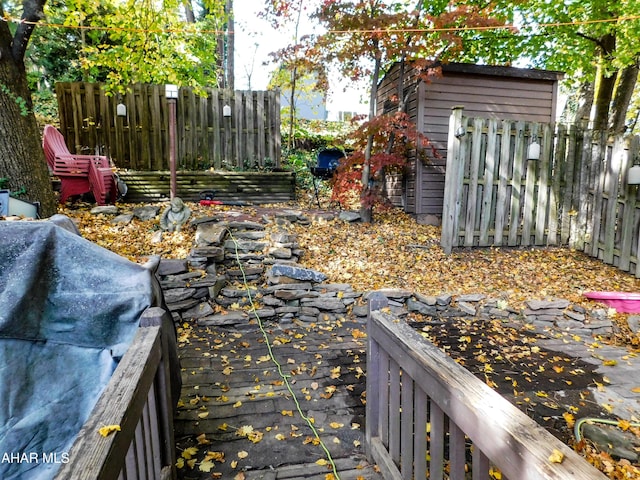 view of yard featuring a wooden deck