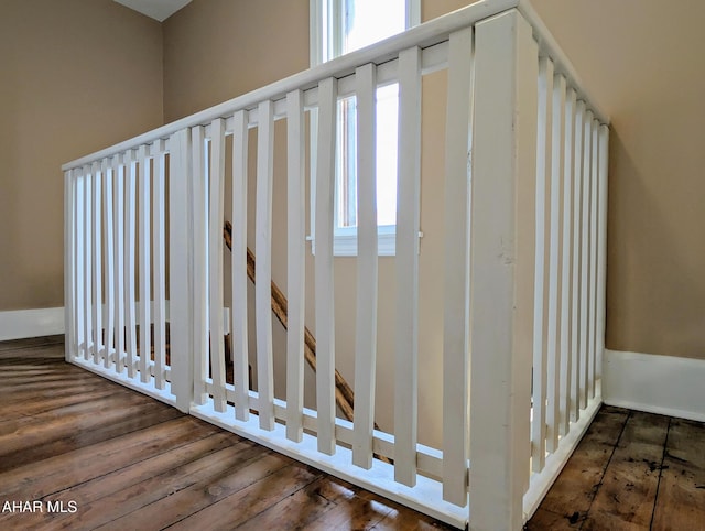 stairway featuring hardwood / wood-style floors