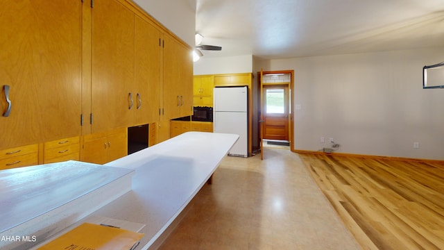 79 Mill Rd, Duncansville, PA 16635 - kitchen featuring freestanding refrigerator, black microwave, and light floors