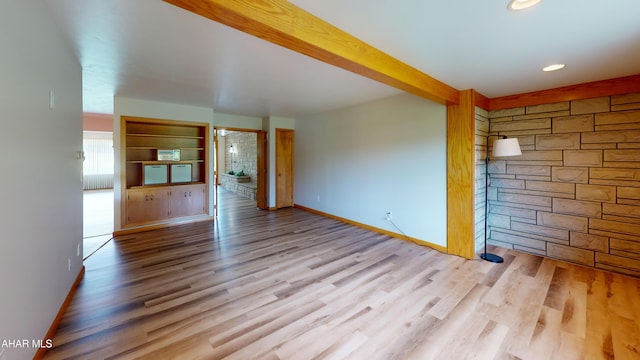79 Mill Rd, Duncansville, PA 16635 - unfurnished living room with wood finished floors, beamed ceiling, and recessed lighting