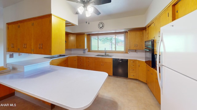 79 Mill Rd, Duncansville, PA 16635 - kitchen featuring black appliances, a peninsula, a ceiling fan, light countertops, and light flooring