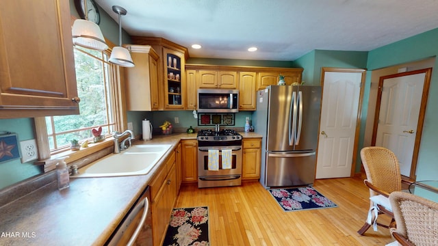 4701 Lynndale Rd, Altoona, PA 16602 - kitchen with stainless steel appliances, glass insert cabinets, light countertops, decorative light fixtures, and recessed lighting