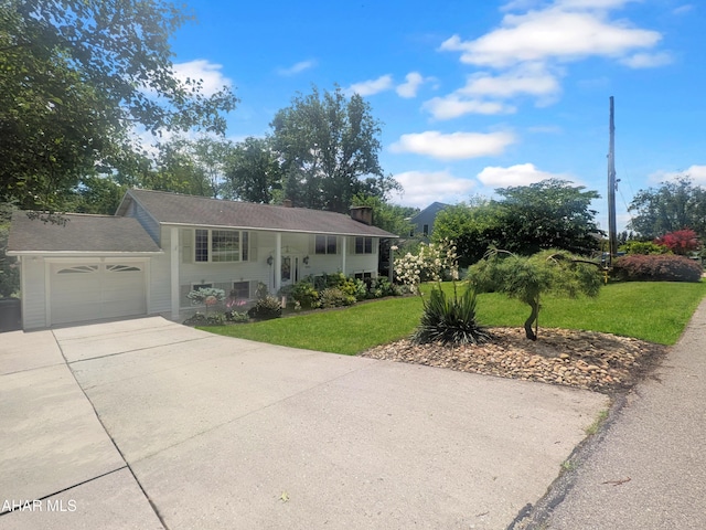 4701 Lynndale Rd, Altoona, PA 16602 - bi-level home with concrete driveway, a front yard, and a garage
