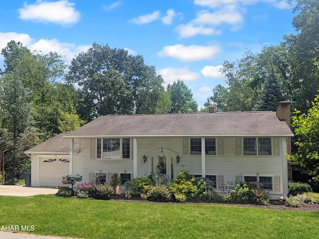 4701 Lynndale Rd, Altoona, PA 16602 - bi-level home featuring driveway, a chimney, a front lawn, a garage, and roof with shingles