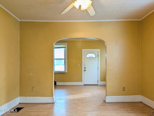 foyer featuring ceiling fan, ornamental molding, and hardwood / wood-style flooring