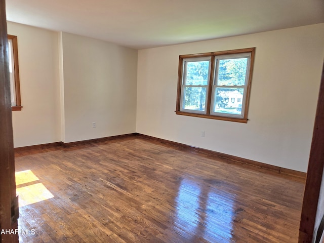 empty room featuring dark hardwood / wood-style floors