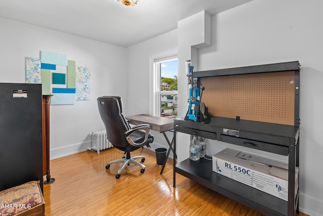 1108 22nd Ave, Altoona, PA 16601 - office area featuring radiator heating unit, light wood-style flooring, and baseboards