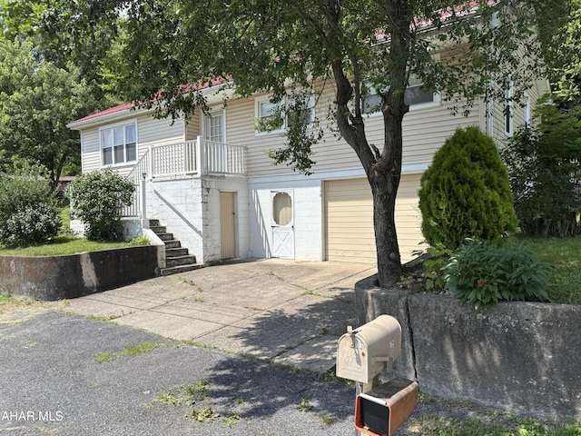 179 Orchard Way, Bedford, PA 15522 - view of front of property with a garage, concrete driveway, and stairway