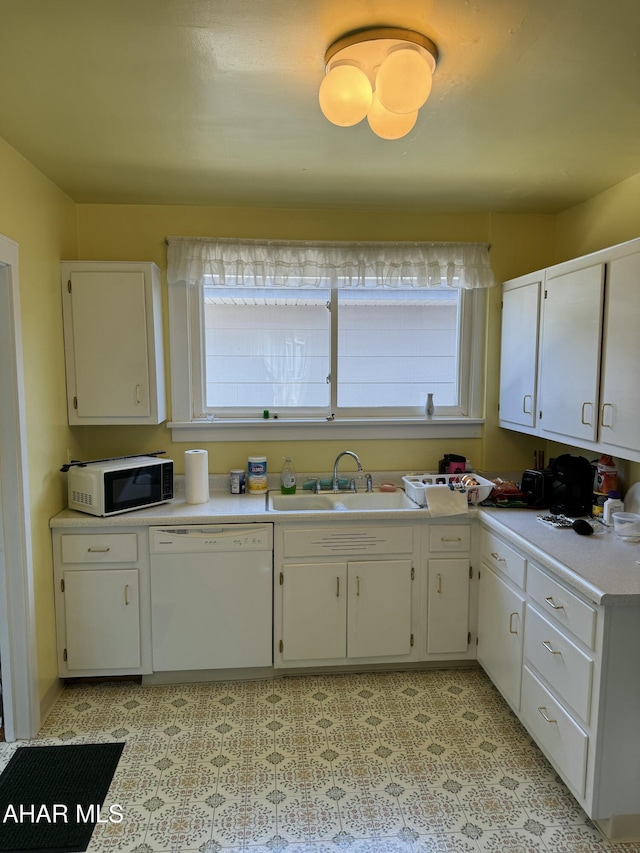 512 26th Ave, Altoona, PA 16601 - kitchen featuring dishwasher, black microwave, light countertops, and white cabinets