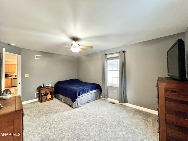 bedroom with carpet flooring, visible vents, and baseboards