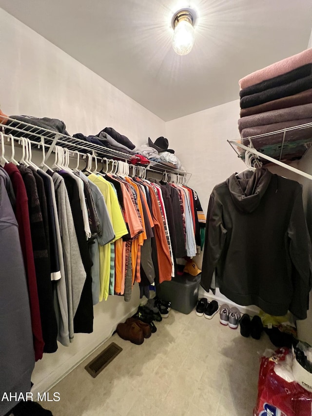 spacious closet featuring visible vents