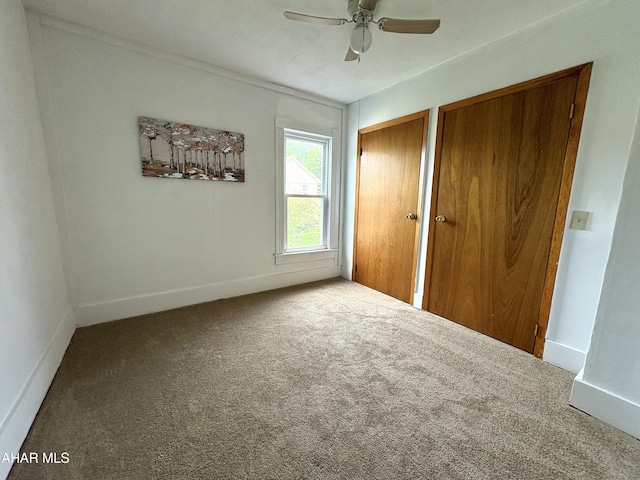 6 B St, Coudersport, PA 16915 - unfurnished bedroom with multiple closets, carpet flooring, and a ceiling fan