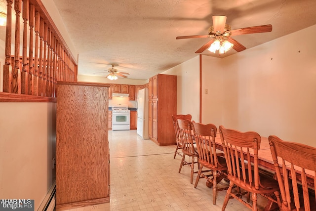 dining area featuring a textured ceiling, ceiling fan, and a baseboard radiator