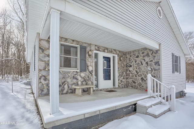 view of snow covered property entrance