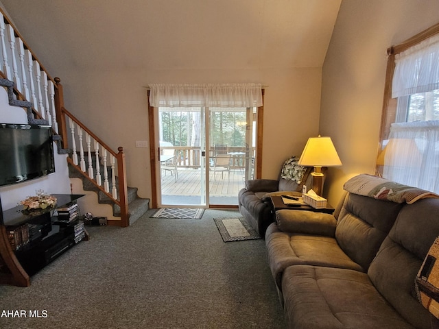 living room with stairs and carpet floors