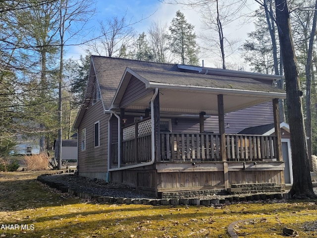 view of home's exterior featuring a shingled roof