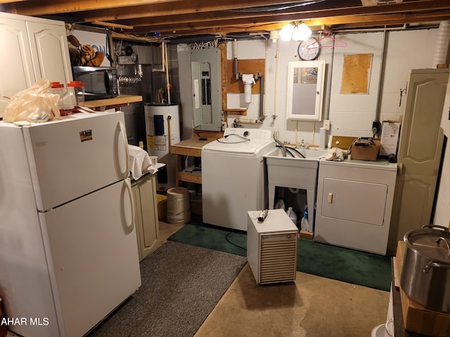 unfinished below grade area with electric panel, separate washer and dryer, water heater, and freestanding refrigerator