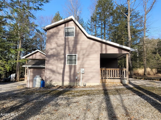 view of property exterior featuring a porch