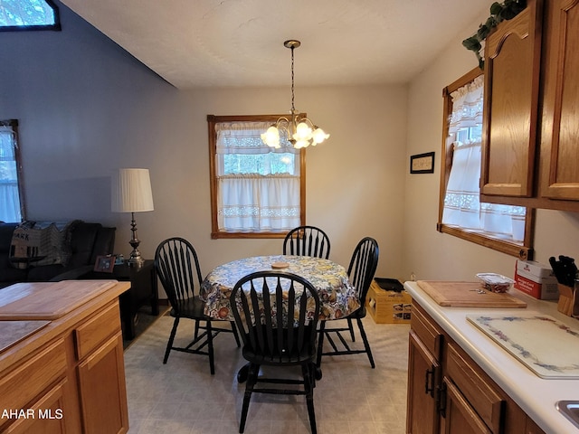 dining space featuring a chandelier