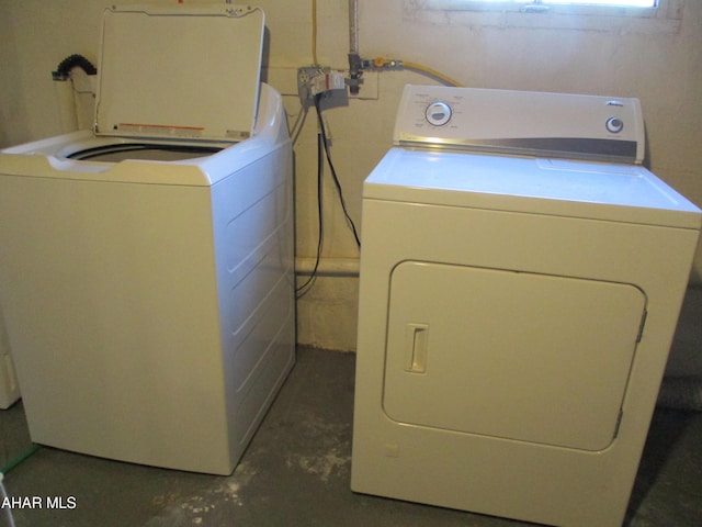 laundry area with washing machine and dryer and laundry area