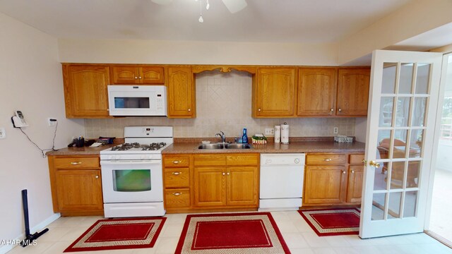 3339 Sylvan Heights Dr, Hollidaysburg, PA 16648 - kitchen with white appliances, brown cabinets, decorative backsplash, and a ceiling fan