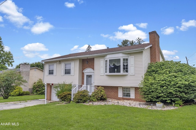 3339 Sylvan Heights Dr, Hollidaysburg, PA 16648 - raised ranch with brick siding, a front yard, a chimney, and driveway