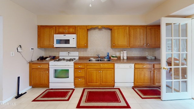 3339 Sylvan Heights Dr, Hollidaysburg, PA 16648 - kitchen featuring white appliances, brown cabinetry, and decorative backsplash