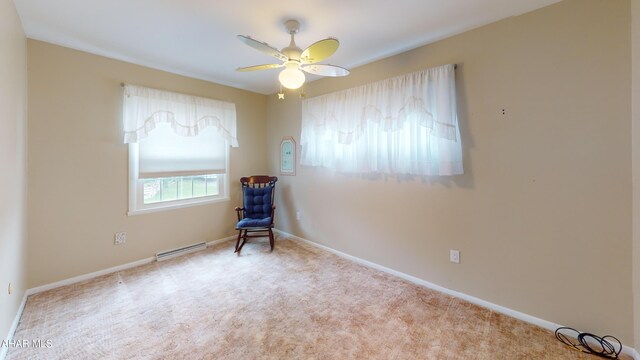 3339 Sylvan Heights Dr, Hollidaysburg, PA 16648 - carpeted empty room with a baseboard radiator and a ceiling fan