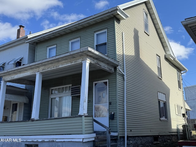 view of home's exterior featuring a porch