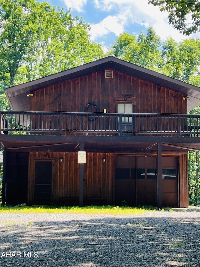 view of front of home with a wooden deck