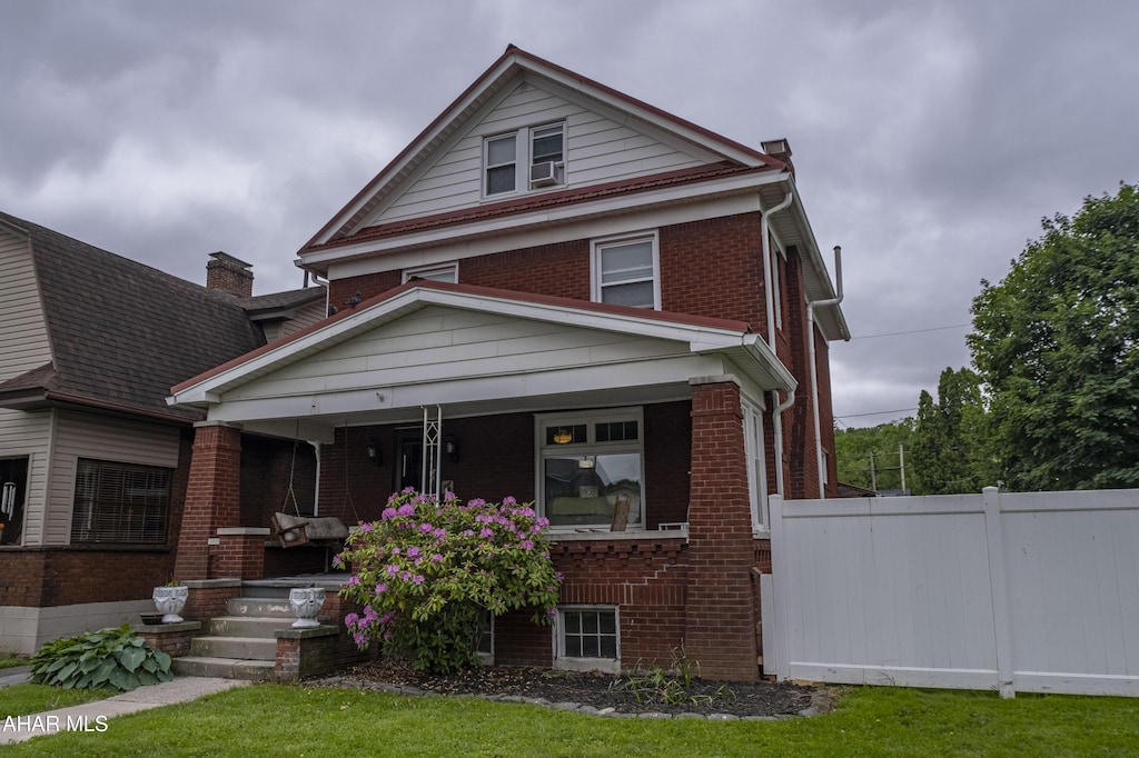 1007 Broadway, Altoona, PA 16601 - american foursquare style home with covered porch and brick siding