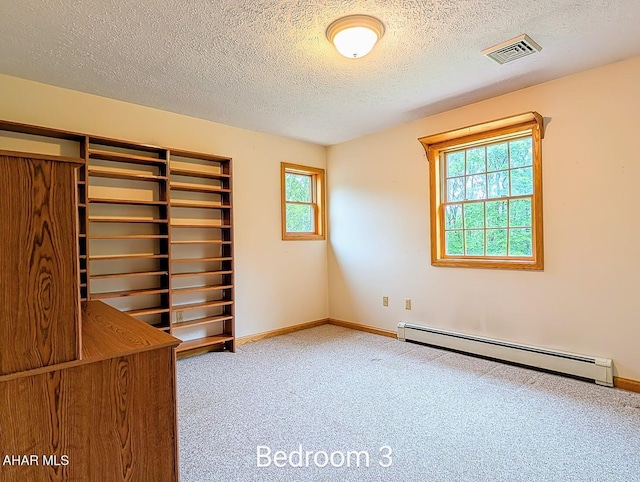 263 Helixville Rd, Schellsburg, PA 15559 - carpeted spare room featuring a baseboard radiator and a textured ceiling