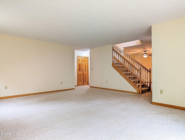 263 Helixville Rd, Schellsburg, PA 15559 - unfurnished living room featuring light colored carpet, stairway, ceiling fan, and a textured ceiling