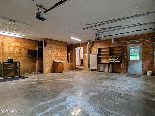263 Helixville Rd, Schellsburg, PA 15559 - garage featuring a garage door opener and wooden walls
