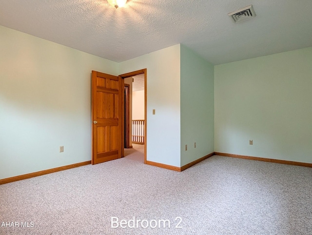 263 Helixville Rd, Schellsburg, PA 15559 - carpeted empty room featuring baseboards and a textured ceiling