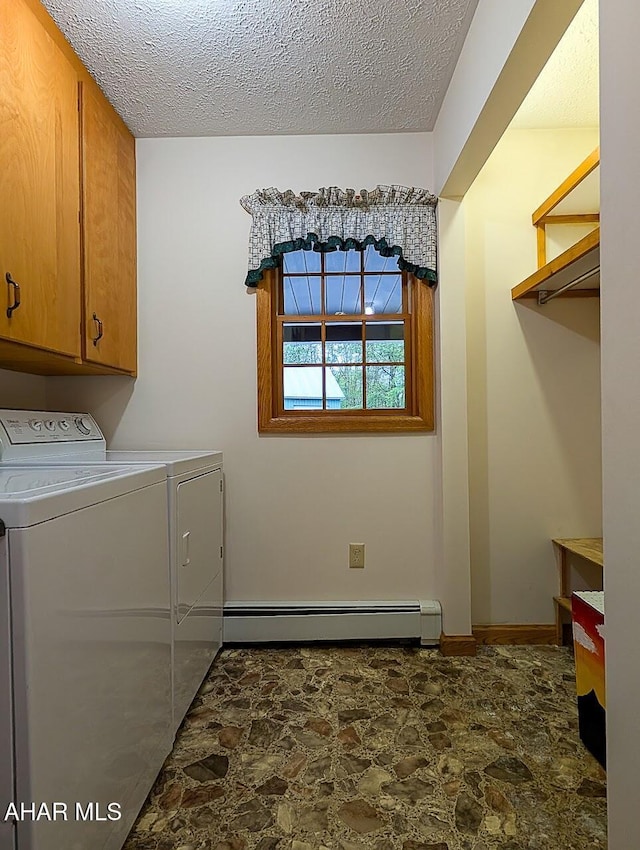 263 Helixville Rd, Schellsburg, PA 15559 - laundry room featuring stone finish floors, washer and dryer, a baseboard heating unit, cabinet space, and a textured ceiling