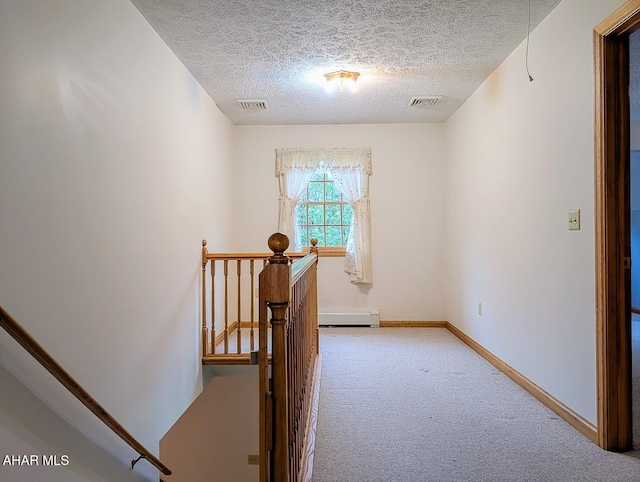 263 Helixville Rd, Schellsburg, PA 15559 - hall with an upstairs landing, carpet floors, baseboard heating, and a textured ceiling