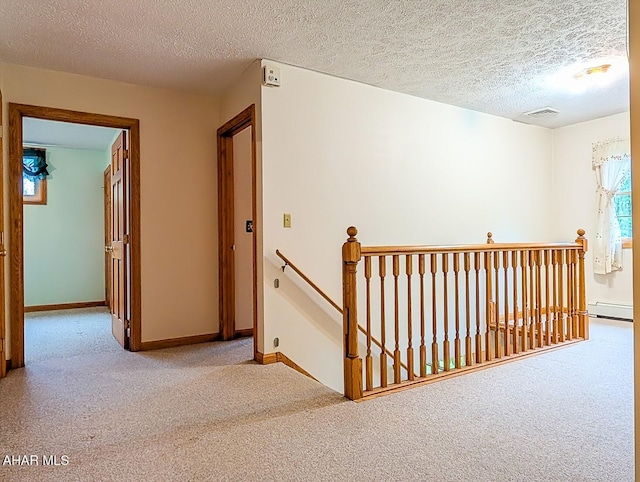 263 Helixville Rd, Schellsburg, PA 15559 - corridor with an upstairs landing, carpet floors, a baseboard heating unit, and a textured ceiling