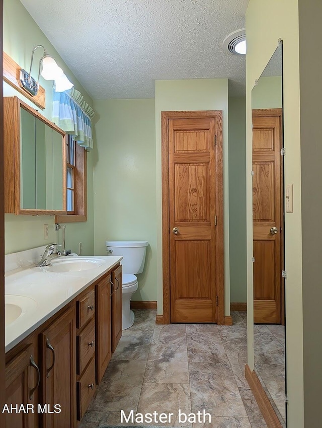 263 Helixville Rd, Schellsburg, PA 15559 - bathroom featuring double vanity and a textured ceiling