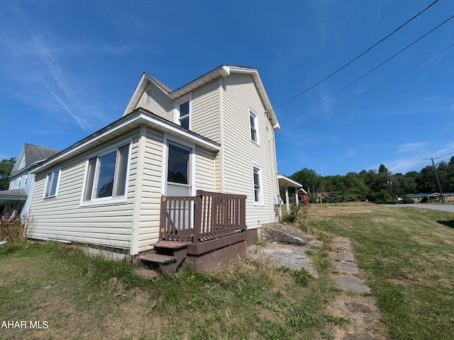 view of home's exterior with a yard