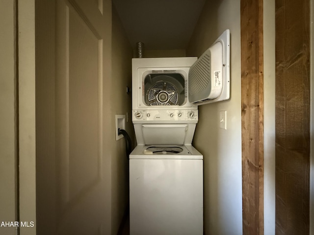 washroom featuring stacked washing maching and dryer