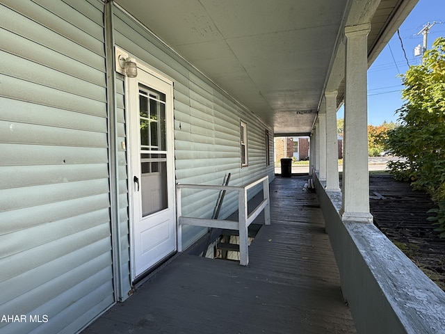 wooden terrace featuring a porch