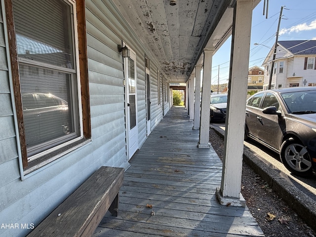 wooden deck featuring covered porch