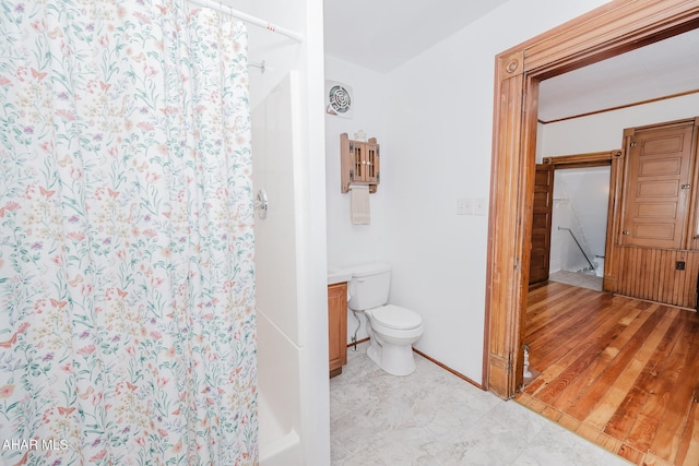 full bath featuring toilet and a shower with shower curtain