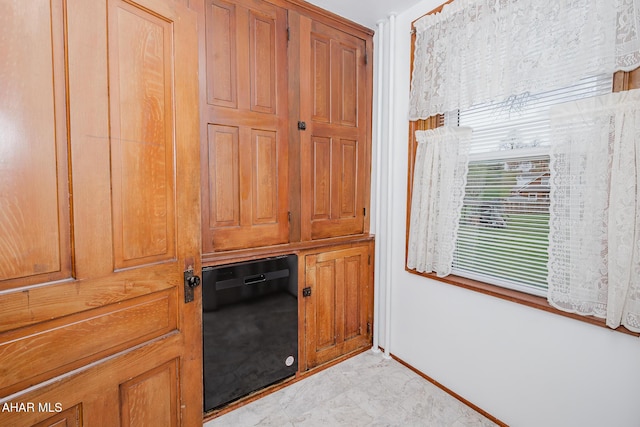 detailed view of dishwasher and baseboards
